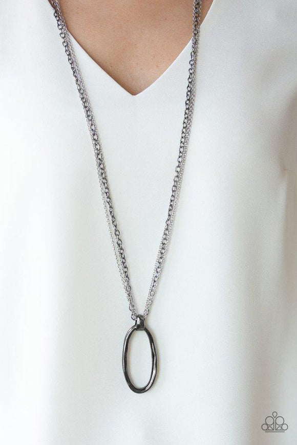 Paparazzi Industrial Confidence - Multi A bold gunmetal pendant swings from the bottom of mismatched silver and gunmetal chains, creating an edgy mixed metallic palette. Features an adjustable clasp closure.

