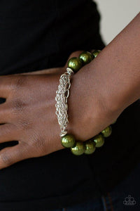 Paparazzi Hollywood HEELS - Green Infused with a section of mismatched silver chains, a refined collection of pearly green beads and dainty silver rings are threaded along a stretchy band around the wrist for a glamorous finish.

