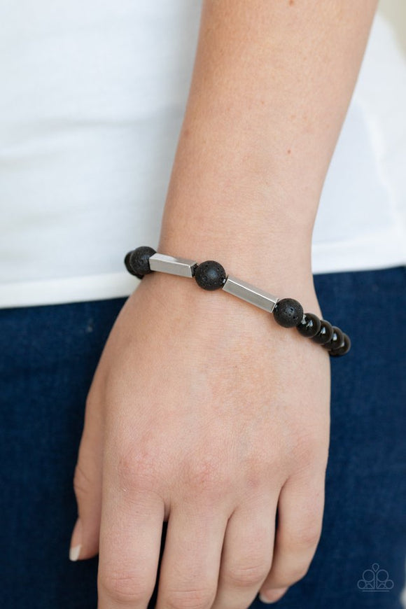 Paparazzi Metro Meditation - Silver - Bracelet  -  An earthy collection of rectangular silver accents, round black lava rock beads, and shiny black beads are threaded along a stretchy band around the wrist for a seasonal look.
