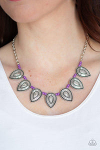 Paparazzi Terra Trailblazer - Purple A collection of dainty purple stone beads and ornate silver teardrop frames are threaded along an invisible wire below the collar for a fierce tribal look. Features an adjustable clasp closure.
