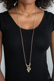 Paparazzi Trendsetting Trinket - Gold - Necklace  -  Featuring flattened edges, a fringe of gold bars swing from the bottom of a dainty gold half-moon frame at the bottom of a lengthened gold chain for a trendy tone-on-tone look. Features an adjustable clasp closure.
