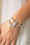 Paparazzi Geo Glam - Silver Brushed in a high-sheen shimmer, geometric silver frames curl around the wrist, creating a tribal inspired cuff. Features a hinged closure.
