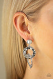 Paparazzi On Scene - White  -  Hammered silver rings link at the bottom of a solitaire white pearl dotted frame for a refined edge. Earring attaches to a standard post fitting.
