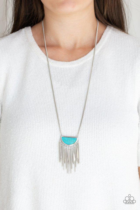 Paparazzi Desert Hustle - Blue Chiseled into a half-moon shape, a refreshing turquoise pendant swings from the bottom of a lengthened silver chain. Flared silver rods and shimmery silver chains stream from the bottom of the pendant for a seasonal finish. Features an adjustable clasp closure.
