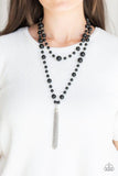 Paparazzi Social Hour - Black A collection of bubbly black beads link into two strands down the chest. A shimmery silver tassel swings from the lowermost strand, adding a timeless twist to the classic beaded palette. Features an adjustable clasp closure.
