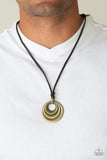Paparazzi Desert Spiral - Brass  -  Textured and smooth beveled brass rings are knotted in place at the bottom of a brown leather cord, creating a rustic pendant. Features an adjustable sliding knot closure.
