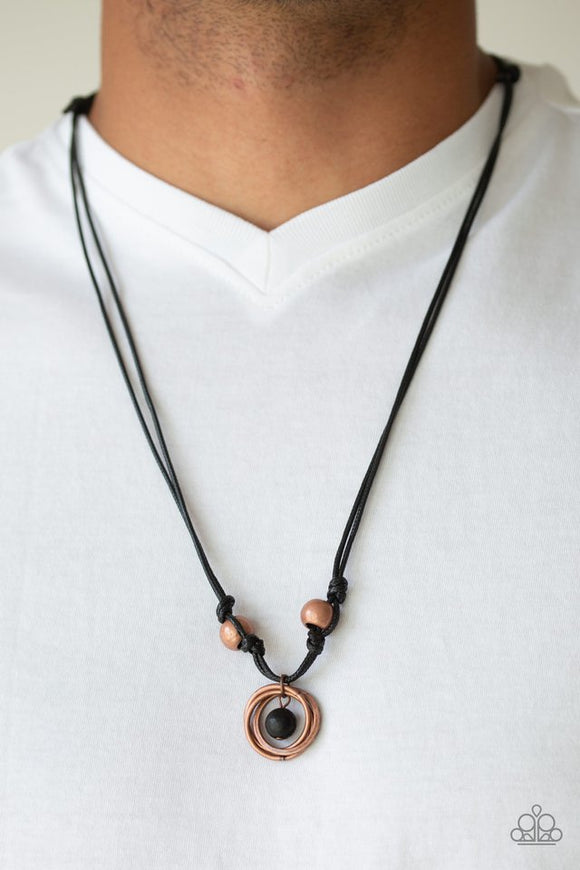 Paparazzi Rural Ringleader - Copper - Necklace  -  Infused with a black lava rock bead and copper beads, copper rings are knotted at the bottom of a shiny black cord for an urban look. Features an adjustable sliding knot closure.
