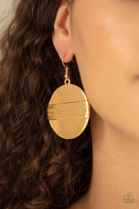 Paparazzi Ultra Uptown - Gold  -  A textured gold band wraps around the center of a glistening gold disc, creating an edgy frame. Earring attaches to a standard fishhook fitting.
