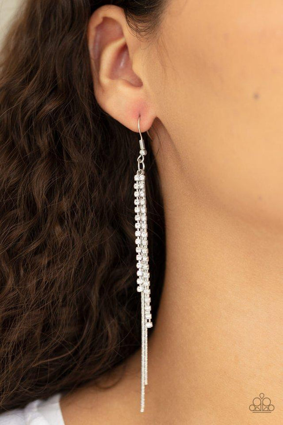 Paparazzi REIGN Check - White  -  Strands of glittery white rhinestones and dainty silver chains stream from the ear, coalescing into a refined tassel. Earring attaches to a standard fishhook fitting.
