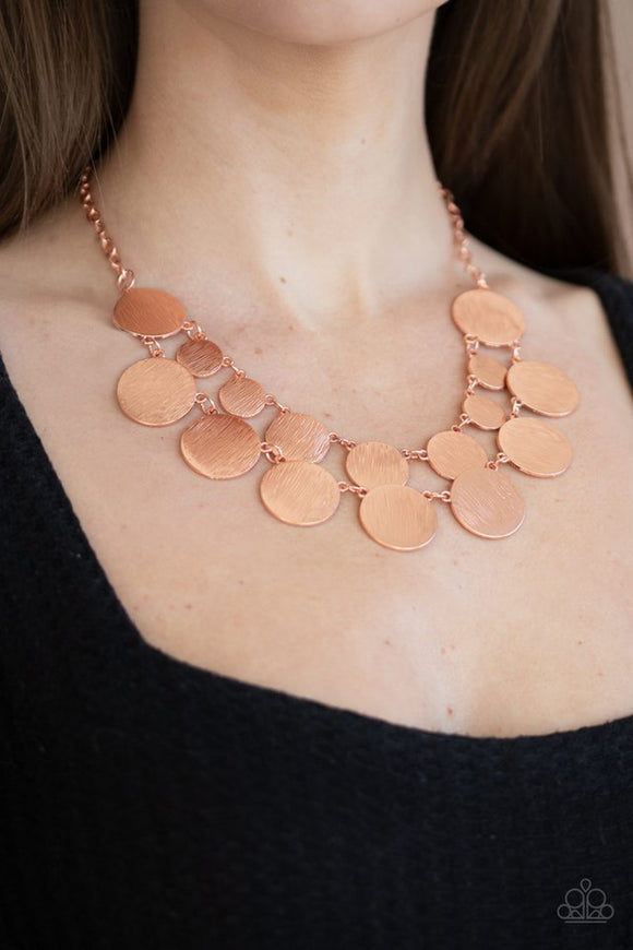Paparazzi Stop and Reflect - Copper  -  Featuring a blinding scratched shimmer, a collection of shiny copper discs link below the collar, creating radiant rows. Features an adjustable clasp closure.
