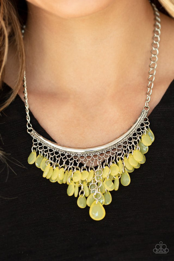 Paparazzi Rio Rainfall - Yellow - Necklace  -  Varying in size, opaque yellow teardrops drip from the bottom of a bowing silver bar, creating an effervescent fringe below the collar. Features an adjustable clasp closure.
