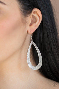 Paparazzi Diamond Distraction - White  -  A glistening silver teardrop is encrusted in rows of glassy white rhinestones for a statement-making look. Earring attaches to a standard fishhook fitting.
