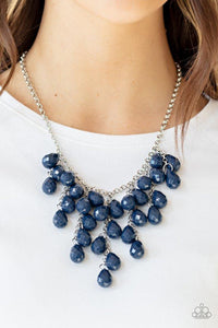 Paparazzi Serenely Scattered - Blue  -  Strands of faceted blue teardrops cascade from the bottom of a shimmery silver chain, creating a vivacious scattered fringe below the collar. Features an adjustable clasp closure.

