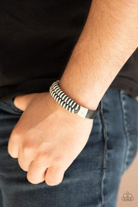 Paparazzi Trail Time - Black  -  Black and white twine knots around a black leather band for a rustic look. Features an adjustable sliding knot closure.
