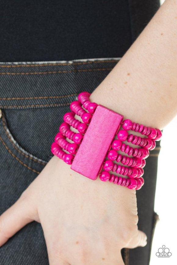 Paparazzi Dont Stop BELIZE-ing - Pink  -  Brushed in a vivacious pink finish, rectangular wooden frames hold together a collection of pink wooden beads threaded along stretchy bands, coalescing into a summery display around the wrist.
