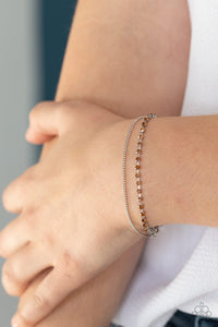 Paparazzi Double The Diamonds - Brown - Bracelet  -  Infused with a dainty silver chain, a glittery collection of classic and golden topaz rhinestones delicately link across the wrist, creating glittery layers. Features an adjustable clasp closure.
