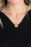 Paparazzi Worlds Best Grandma - Gold  -  Stamped in the word, "grandma," in whimsical script, a dainty gold disc swings below the collar for a classic look. Features an adjustable clasp closure.
