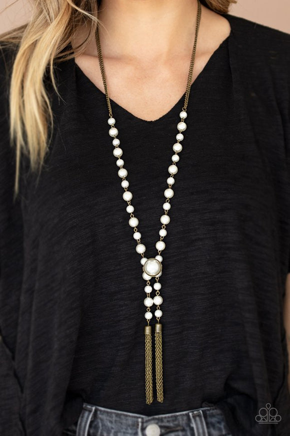 Paparazzi Vintage Diva - Brass - Necklace  -  Pearl dotted brass chains give way to two brass chain tassels. Featuring an oversized pearl, an elegant brass fitting delicately pinches the strands together, creating a vintage inspired look. Features an adjustable clasp closure.
