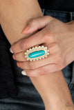 Paparazzi Mystic Oasis - Gold - Ring  -  Featuring a textured gold frame, an oversized oblong turquoise stone is bordered in dainty opalescent stone beads for an ethereal effect. Features a stretchy band for a flexible fit.
