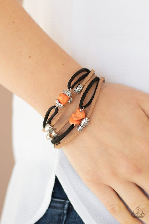 Paparazzi Rocky Mountain Rebel - Orange  -  A mismatched collection of dainty silver beads and bits of orange rock decorate strands of black and brown suede across the wrist for a whimsically layered look. Features an adjustable clasp closure.

