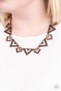 Paparazzi Giza Goals - Copper - Necklace  -  Etched and stamped in zigzagging patterns, a collection of antiqued copper triangular frames delicately link below the collar for a bold tribal look. Features an adjustable clasp closure.
