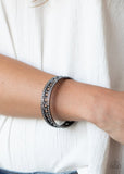 Paparazzi Couture Court - Black - Bracelet  -  Bordered in rows of blinding white rhinestones, a glistening strand of gunmetal chain glamorously links around the wrist, coalescing into an unapologetically glittery bangle.
