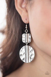 Paparazzi Lure Allure - Silver - Earrings  -  Brushed in an antiqued shimmer, a hammered square and oval silver frame have been threaded along a dainty rod, creating a handcrafted lure. Earring attaches to a standard fishhook fitting.
