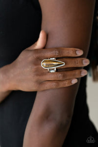Paparazzi Spiritual Awakening - Brown - Ring  -  An elongated Tiger's Eye stone teardrop is pressed into a sleek silver frame atop the finger, creating a mystical centerpiece. Features a dainty stretchy band for a flexible fit.
