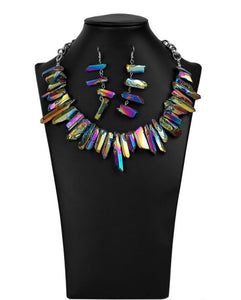 Paparazzi Charismatic - 2020 Zi Signature Collection  -  Featuring an oil spill iridescence, raw cut pieces of hematite are threaded along an invisible wire below the collar for a colorfully courageous look. Features an adjustable clasp closure.
