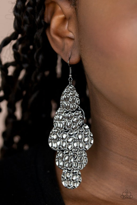 Paparazzi Instant Incandescence - Black - Earrings - Featuring metallic honeycomb-like patterns, glistening gunmetal teardrop frames cascade from the ear, coalescing into a noise-making lure. Earring attaches to a standard fishhook fitting. 