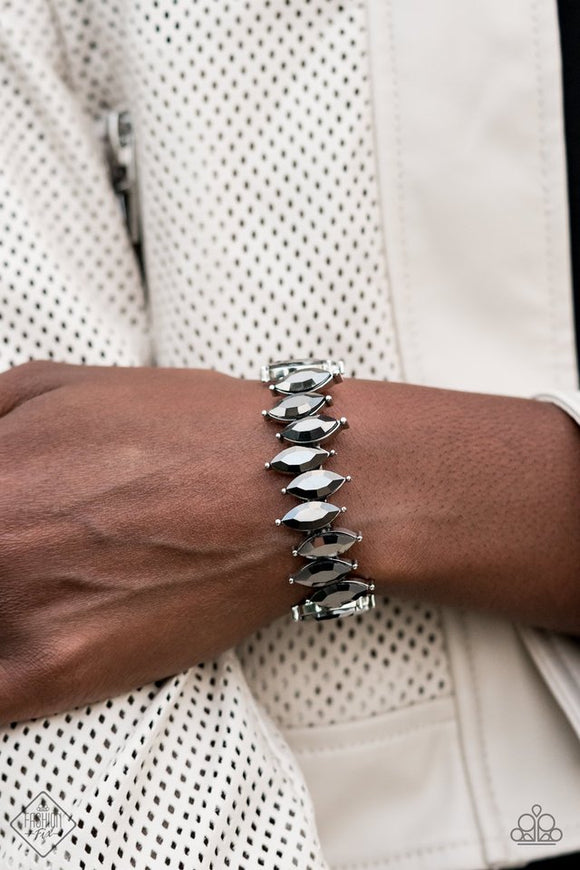 Paparazzi Fiercely Fragmented - Silver - Bracelet  -  A row of hematite marquise-cut rhinestones are threaded along stretchy bands and wrapped around the wrist, creating a smoldering shimmer. The exaggerated points and sharp edges make a bold and dramatic statement.
