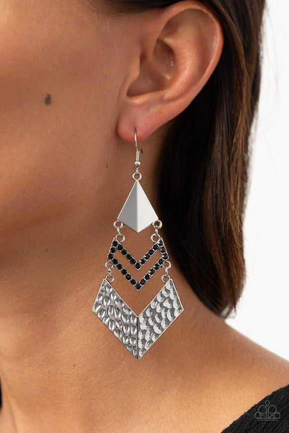 Paparazzi Work Hazard - Black - Earrings - A creased silver kite-shaped frame, black rhinestone encrusted chevron-like frame, and hammered silver chevron-like frame link into an edgy lure. Earring attaches to a standard fishhook fitting. 