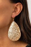 Paparazzi Metallic Mirrors - Gold - Earrings  -  Hammered in a blinding finish, a rippling gold teardrop swings from the ear for a bold industrial flair. Earring attaches to a standard fishhook fitting.
