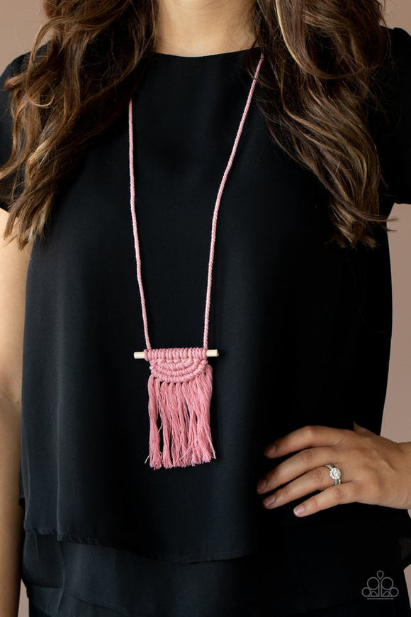 Paparazzi Between You and MACRAME - Pink - Necklace  -  Rose Tan cording delicately wraps around a dainty wooden dowel, knotting into a tasseled macramé centerpiece at the bottom of a dramatically lengthened display. Features an adjustable sliding knot closure.
