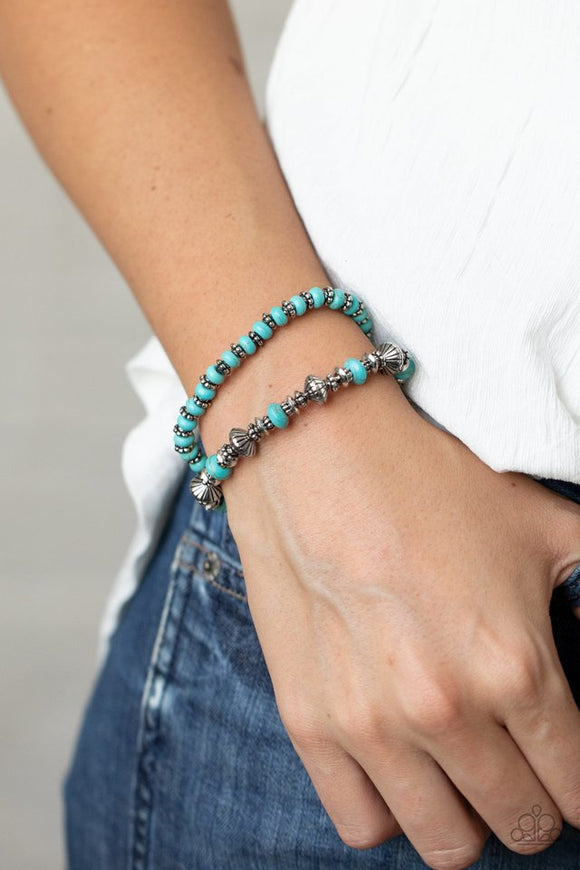Paparazzi Cactus Quest - Blue - Bracelet  -  A mismatched assortment of turquoise stone beads and decorative silver beads are threaded along stretchy bands around the wrist, creating an earthy pair.
