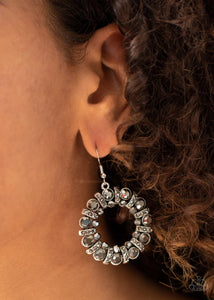 Paparazzi Baby, Its Cold Outside - Silver - Earrings  -  An explosion of round hematite rhinestones and hematite rhinestone dotted silver bars coalesce into a smoldering hoop. 
