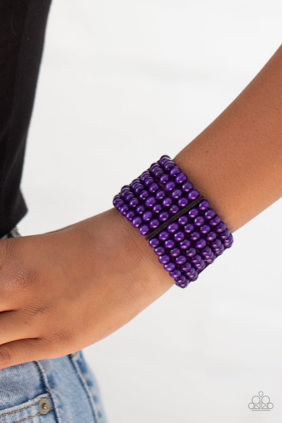Paparazzi Tanning in Tanzania - Purple - Bracelet  -  Held together with rectangular wooden fittings, strands of vivacious purple wooden beads are threaded along stretchy bands that layer around the wrist into one colorful stretch bracelet
