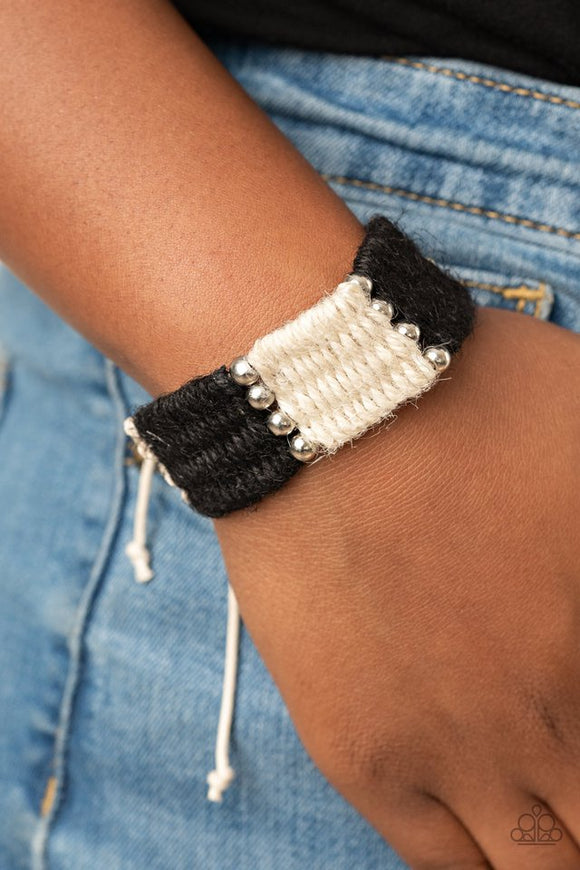 Paparazzi High Tides - Black - Bracelet  -  Infused with classic silver beads, white and black twine-like cording knots and weaves around the wrist for a colorful beach inspired look. Features an adjustable sliding knot closure.
