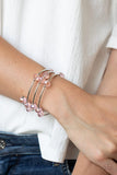 Paparazzi Dreamy Demure - Pink - Bracelet  -  Glittery pink crystal-like beads, silver rods, and dainty silver beads are threaded along a coiled wire, creating a glamorous infinity wrap style bracelet around the wrist.
