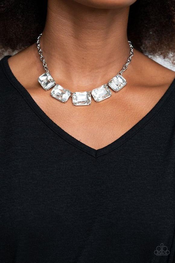 Paparazzi Deep Freeze Diva - White - Necklace  -  Featuring regal emerald style cuts, an oversized collection of white rhinestones dramatically link below the collar for an icy finish. Features an adjustable clasp closure.
