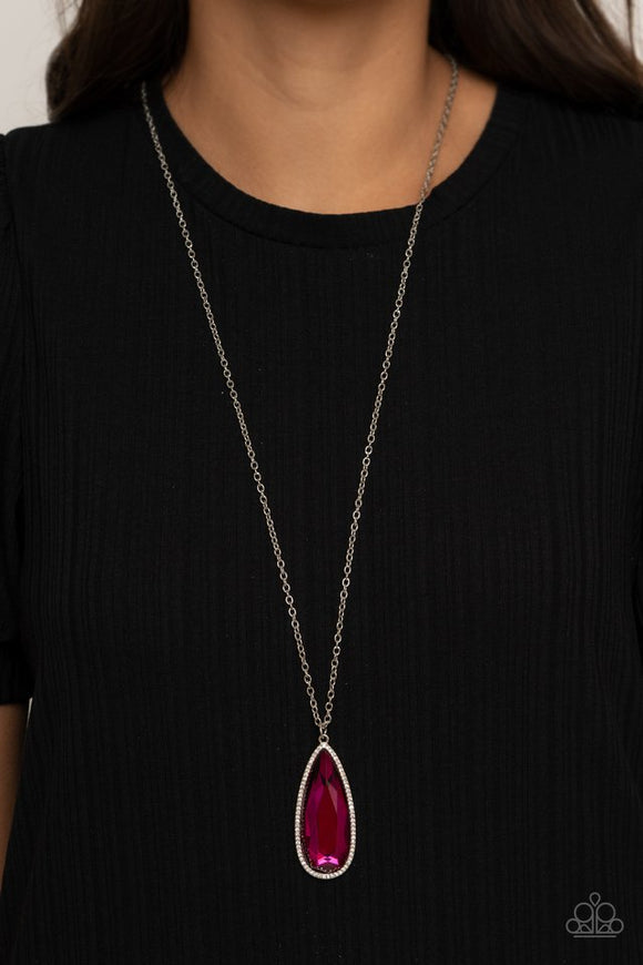 Paparazzi Watch Out For REIGN - Pink - Necklace  -  Bordered in a white rhinestone encrusted frame, an oversized Pink Peacock teardrop swings from the bottom of a lengthened silver chain, creating a regal pendant. Features an adjustable clasp closure.
