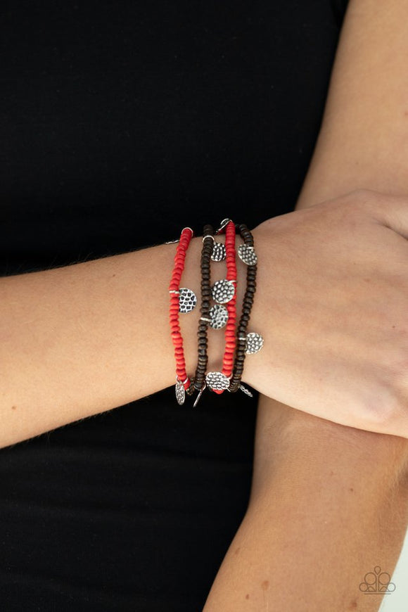 Paparazzi WOODnt Count It - Red - Bracelet  -  Infused with hammered silver discs, a dainty collection of brown and red wooden beads are threaded along stretchy bands around the wrist, creating colorful layers.
