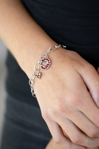 Paparazzi Move over Matchmaker! - Red - Bracelet - As if cut out from the red rhinestone encrusted disc, a glittery heart charm swings alongside a matching heart charm along a chunky silver chain around the wrist for a flirtatious look. Features an adjustable clasp closure. 