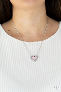 Paparazzi Game, Set, MATCHMAKER - Pink - Necklace  -  Bordered in a shiny silver frame, a pink rhinestone encrusted silver heart is suspended below the collar for a gorgeously romantic look. Features an adjustable clasp closure.
