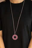 Paparazzi High-Value Target - Pink - Necklace  -  Dotted in dainty pink rhinestones, shiny silver rings radiate out into a fabulously stacked pendant at the bottom of a lengthened silver chain. Features an adjustable clasp closure.
