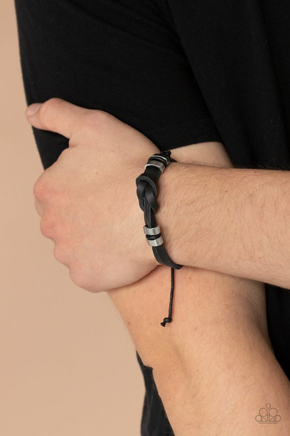 Paparazzi Like It Or KNOT - Black - Bracelet  -  Infused with silver frames and rubbery black accents, two black leather bands loop into an infinity knotted piece around the wrist for an urban look. Features an adjustable sliding knot closure.
