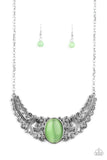 Paparazzi Celestial Eden - Green - Necklace  -  Featuring vine and floral details, leafy silver frames branch out from an oversized green cat's eye stone center, creating a dramatically whimsical centerpiece below the collar. Features an adjustable clasp closure.
