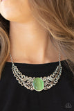 Paparazzi Celestial Eden - Green - Necklace  -  Featuring vine and floral details, leafy silver frames branch out from an oversized green cat's eye stone center, creating a dramatically whimsical centerpiece below the collar. Features an adjustable clasp closure.
