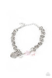 Paparazzi Lovable Luster - Pink - Bracelet  -  Pink crystal-like beads, a dainty white rhinestone, and a silver disc stamped in the word, "love," adorn a double-linked silver chain, creating a flirty fringe around the wrist. Features an adjustable clasp closure.
