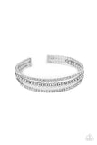 Paparazzi High-End Eye Candy - White - Bracelet  -  Two strands of dazzling white rhinestones flank a row of shiny silver beads, coalescing into a sparkly layered cuff around the wrist.

